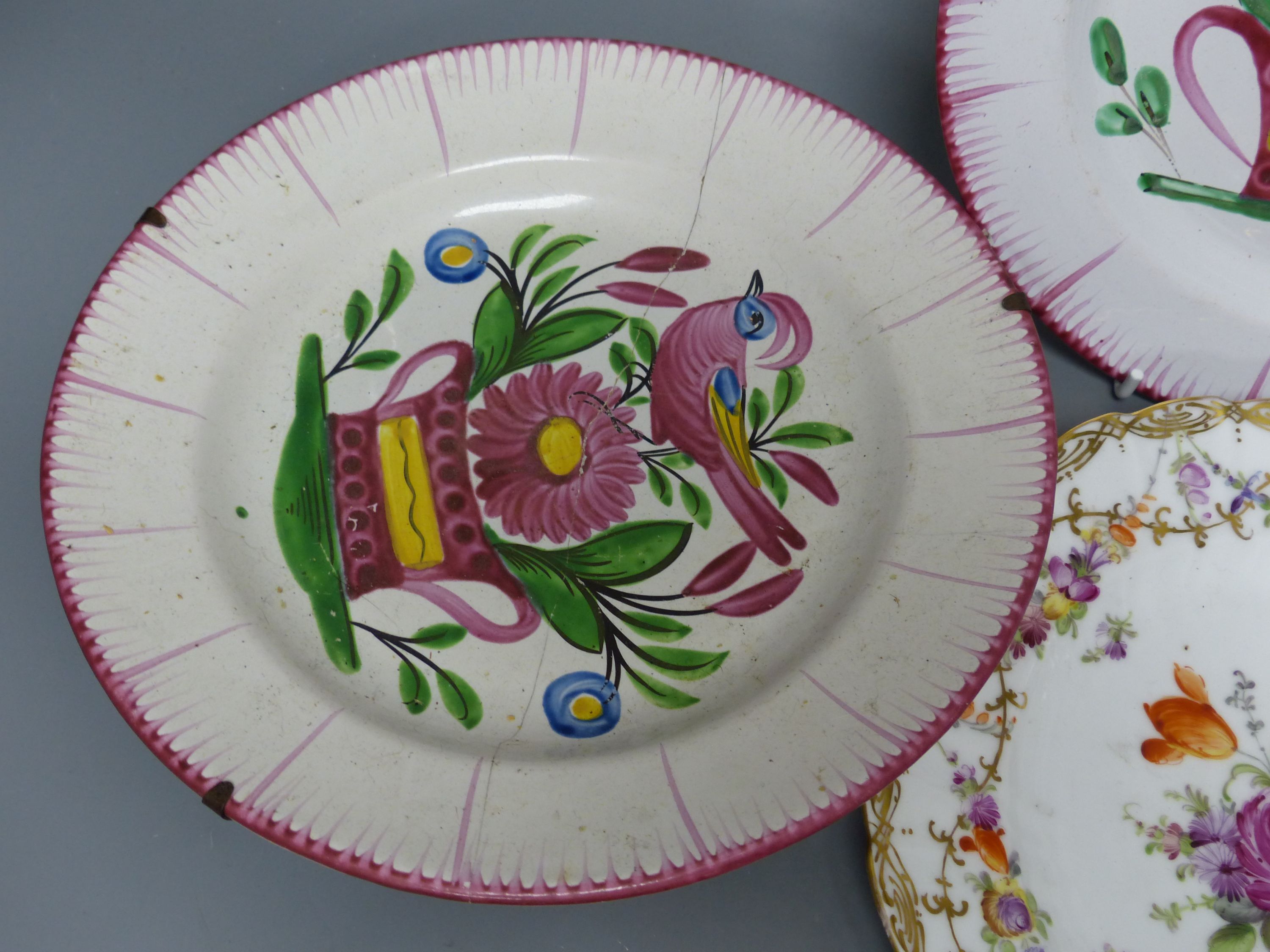 Seven French faience plates and a Dresden plate